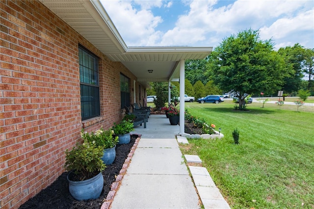 126 SW Mockingbird Way, Lake City, FL 32024 - covered porch featuring a yard