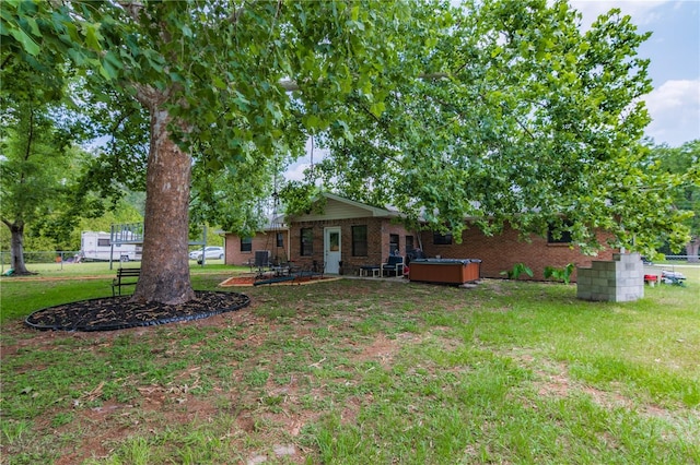 126 SW Mockingbird Way, Lake City, FL 32024 - view of yard with a hot tub and a patio