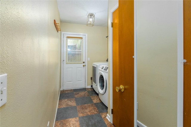 126 SW Mockingbird Way, Lake City, FL 32024 - laundry room with separate washer and dryer, baseboards, and stone finish flooring