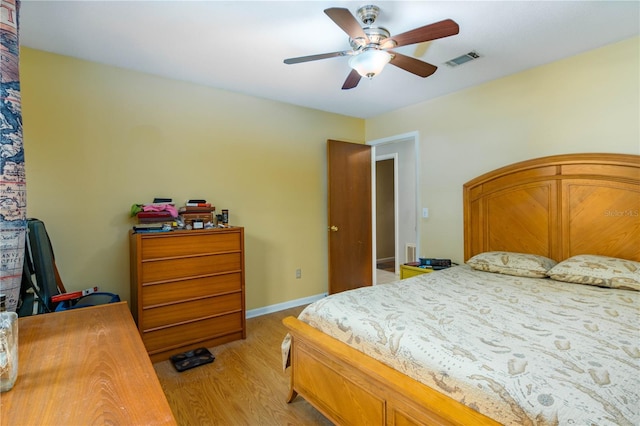 126 SW Mockingbird Way, Lake City, FL 32024 - bedroom featuring light wood-style floors, ceiling fan, and baseboards