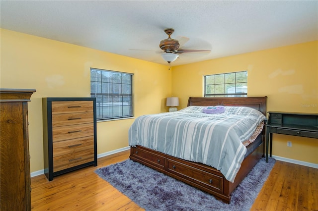 126 SW Mockingbird Way, Lake City, FL 32024 - bedroom featuring wood finished floors, baseboards, and ceiling fan
