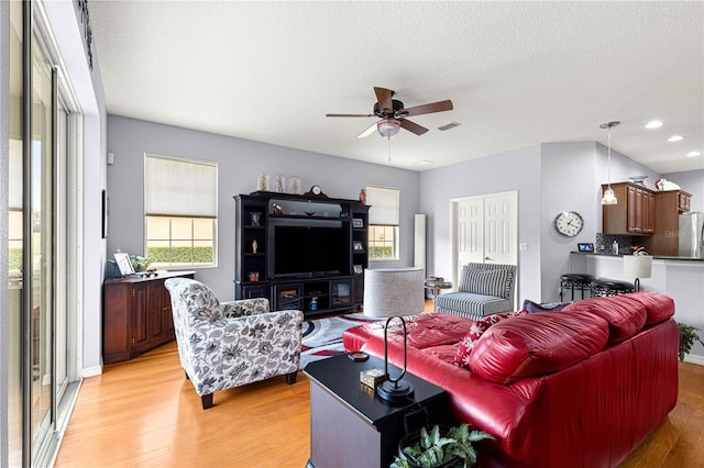 9551 SW 92nd Ter, Ocala, FL 34481 - living room featuring ceiling fan, light wood finished floors, recessed lighting, and a textured ceiling