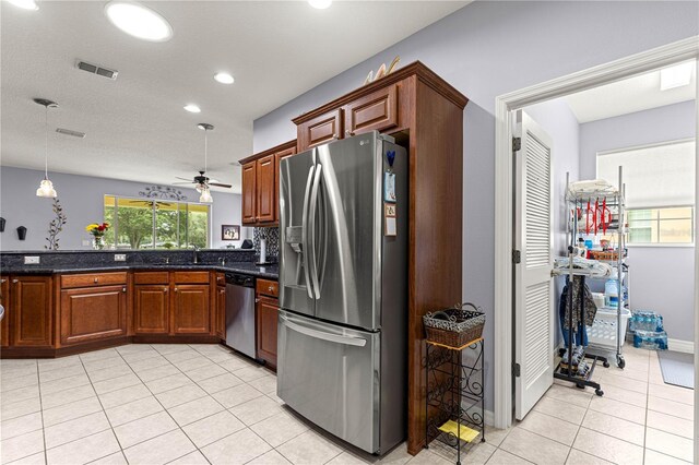 9551 SW 92nd Ter, Ocala, FL 34481 - kitchen with stainless steel appliances, ceiling fan, light tile patterned floors, recessed lighting, and a sink