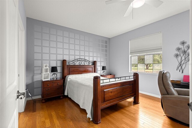 9551 SW 92nd Ter, Ocala, FL 34481 - bedroom featuring wood finished floors, a desk, baseboards, and a ceiling fan