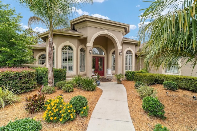 3986 SE 43rd Cir, Ocala, FL 34480 - view of exterior entry with stucco siding and french doors