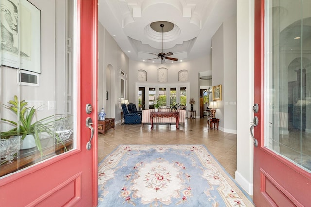 3986 SE 43rd Cir, Ocala, FL 34480 - tiled entryway with a high ceiling, a ceiling fan, a raised ceiling, and recessed lighting