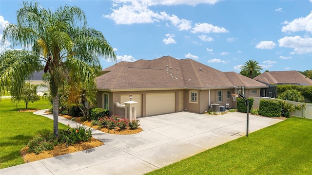3986 SE 43rd Cir, Ocala, FL 34480 - view of front of house featuring a garage, stucco siding, a front lawn, and concrete driveway