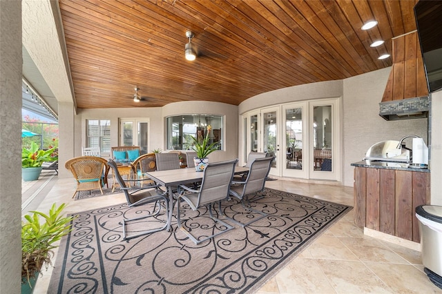 3986 SE 43rd Cir, Ocala, FL 34480 - view of patio / terrace with french doors, outdoor dining area, and exterior kitchen
