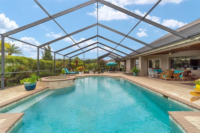 3986 SE 43rd Cir, Ocala, FL 34480 - view of swimming pool featuring a patio, a pool with connected hot tub, glass enclosure, and a ceiling fan