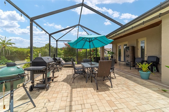 3986 SE 43rd Cir, Ocala, FL 34480 - view of patio / terrace featuring outdoor dining space, a lanai, and grilling area