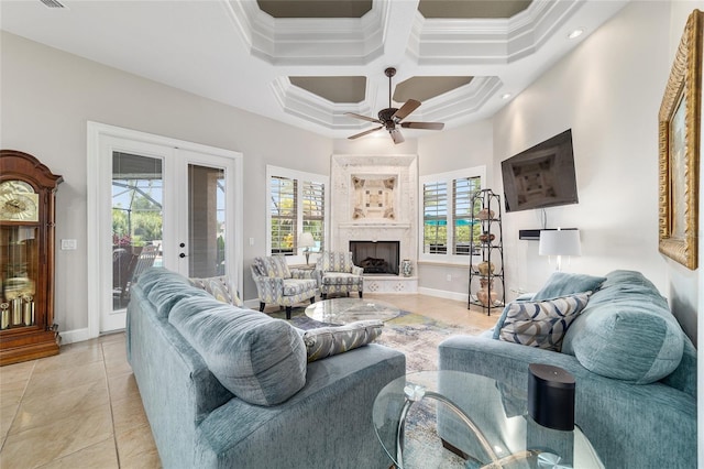 3986 SE 43rd Cir, Ocala, FL 34480 - living room featuring ceiling fan, light tile patterned flooring, french doors, ornamental molding, and coffered ceiling