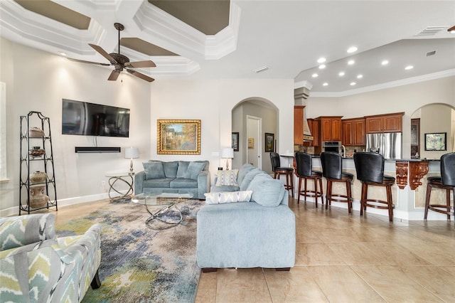 3986 SE 43rd Cir, Ocala, FL 34480 - living area with arched walkways, ornamental molding, ceiling fan, recessed lighting, and light tile patterned floors
