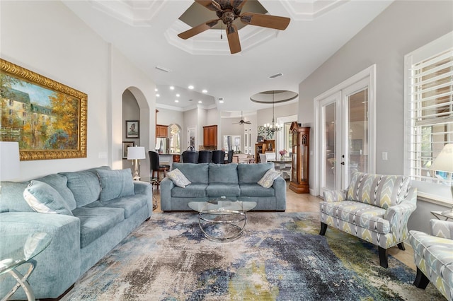3986 SE 43rd Cir, Ocala, FL 34480 - living room with ceiling fan, arched walkways, a chandelier, crown molding, and recessed lighting