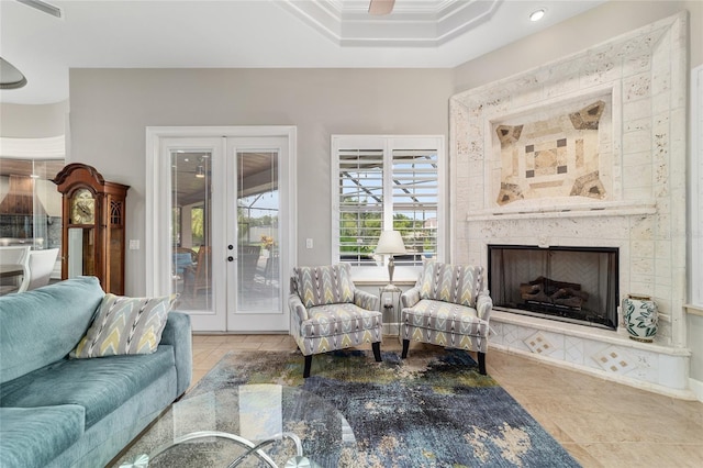 3986 SE 43rd Cir, Ocala, FL 34480 - living room featuring french doors, tile patterned flooring, a fireplace with raised hearth, recessed lighting, and ceiling fan