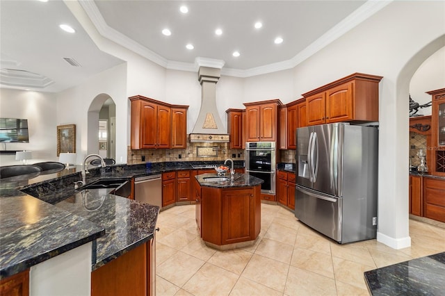 3986 SE 43rd Cir, Ocala, FL 34480 - kitchen with appliances with stainless steel finishes, arched walkways, tasteful backsplash, crown molding, and recessed lighting