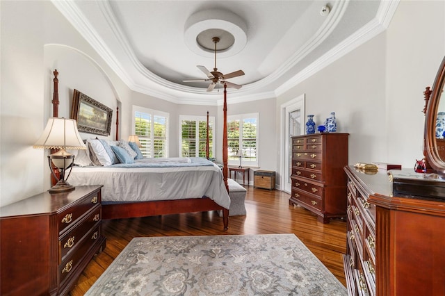3986 SE 43rd Cir, Ocala, FL 34480 - bedroom with a tray ceiling, ornamental molding, dark wood finished floors, and a ceiling fan