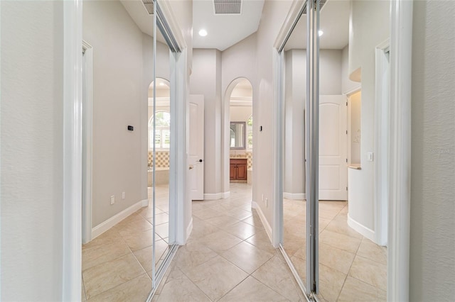 3986 SE 43rd Cir, Ocala, FL 34480 - hall with arched walkways and light tile patterned floors