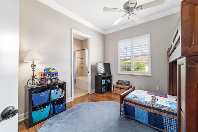 3986 SE 43rd Cir, Ocala, FL 34480 - bedroom with crown molding, wood finished floors, ensuite bathroom, and ceiling fan