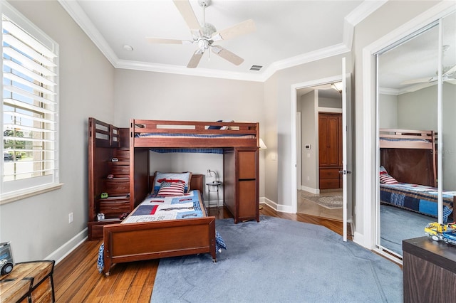 3986 SE 43rd Cir, Ocala, FL 34480 - bedroom featuring wood finished floors, crown molding, and a ceiling fan