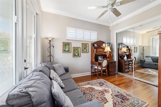 3986 SE 43rd Cir, Ocala, FL 34480 - living room with a ceiling fan, healthy amount of natural light, wood finished floors, and crown molding