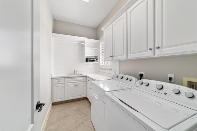3986 SE 43rd Cir, Ocala, FL 34480 - laundry room featuring cabinet space, washer and clothes dryer, and light tile patterned flooring