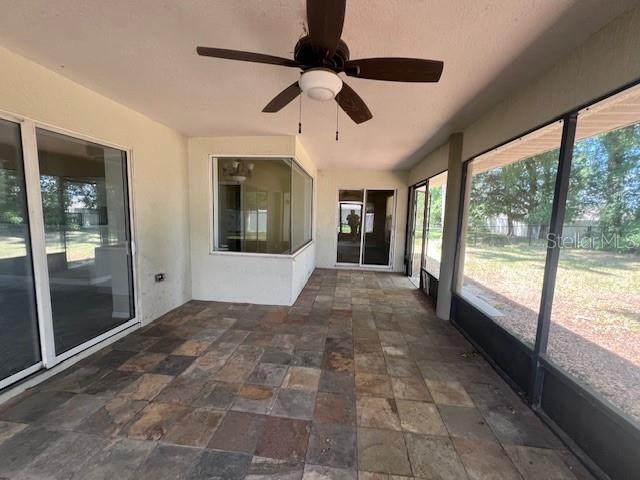 8100 SW 56th Ter, Ocala, FL 34476 - unfurnished sunroom with ceiling fan