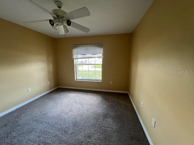 8100 SW 56th Ter, Ocala, FL 34476 - spare room featuring baseboards, carpet flooring, and ceiling fan
