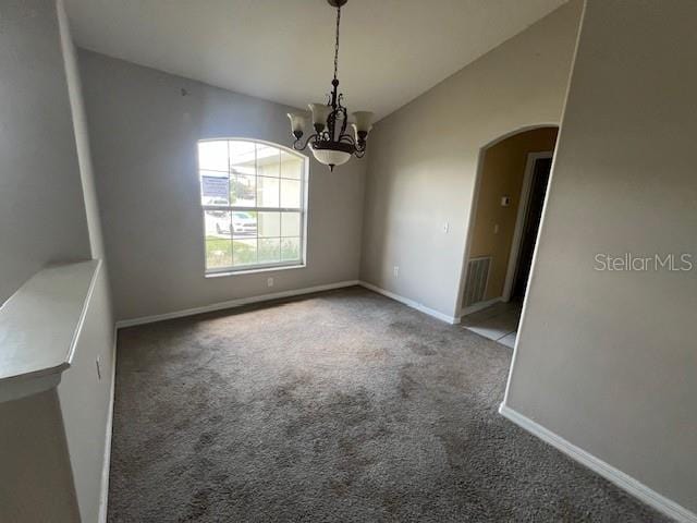 8100 SW 56th Ter, Ocala, FL 34476 - spare room with arched walkways, carpet flooring, a chandelier, baseboards, and lofted ceiling