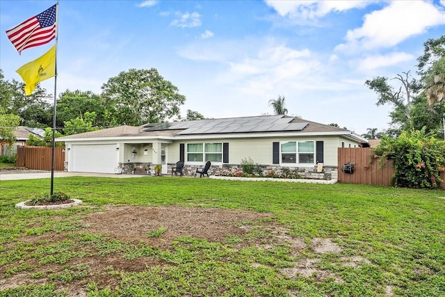 460 E Haines Blvd, Lake Alfred, FL 33850 - single story home featuring stone siding, driveway, a garage, and solar panels