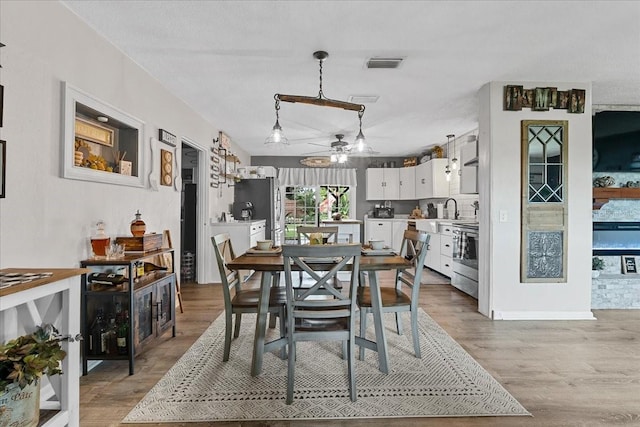 460 E Haines Blvd, Lake Alfred, FL 33850 - dining space with light wood-style flooring