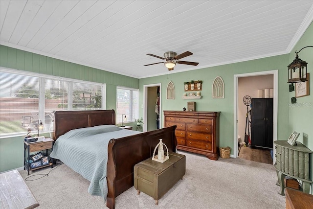460 E Haines Blvd, Lake Alfred, FL 33850 - carpeted bedroom with crown molding, a walk in closet, and a ceiling fan