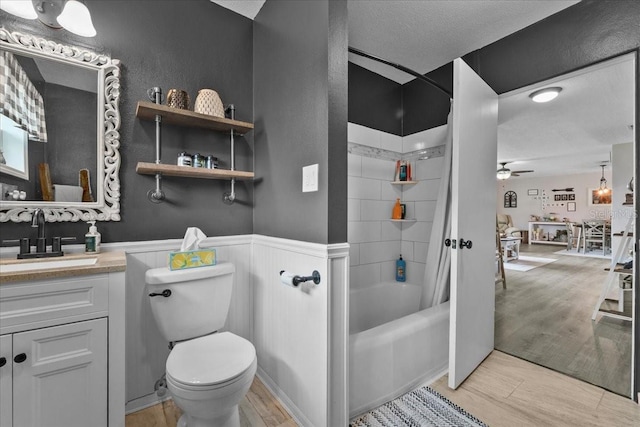 460 E Haines Blvd, Lake Alfred, FL 33850 - bathroom featuring vanity, wood finished floors, toilet, shower / tub combination, and a ceiling fan