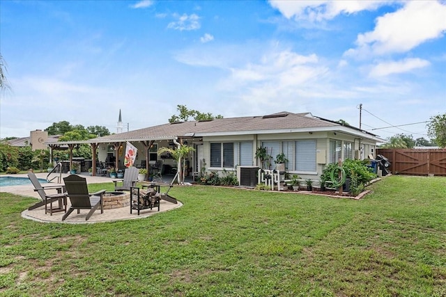 460 E Haines Blvd, Lake Alfred, FL 33850 - back of house featuring an outdoor fire pit, a patio area, and central AC unit