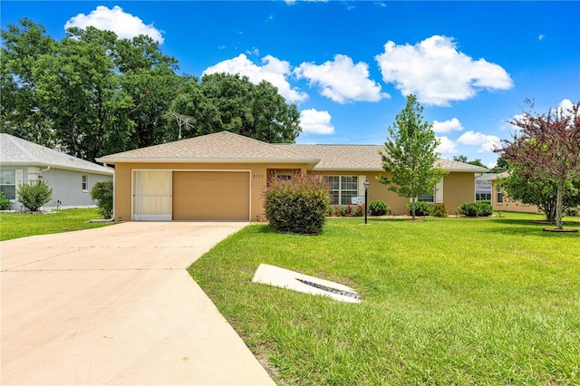 8732 SW 60th Cir, Ocala, FL 34476 - ranch-style home featuring a garage, driveway, and a front yard