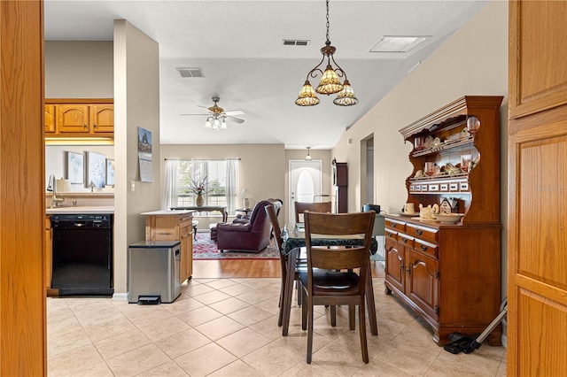8732 SW 60th Cir, Ocala, FL 34476 - dining room with ceiling fan, light tile patterned flooring, a chandelier, and a textured ceiling