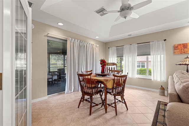 8732 SW 60th Cir, Ocala, FL 34476 - dining space with light tile patterned flooring, ceiling fan, a raised ceiling, baseboards, and recessed lighting