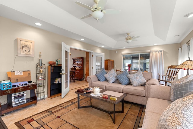 8732 SW 60th Cir, Ocala, FL 34476 - living area with ceiling fan, a raised ceiling, recessed lighting, light tile patterned floors, and french doors