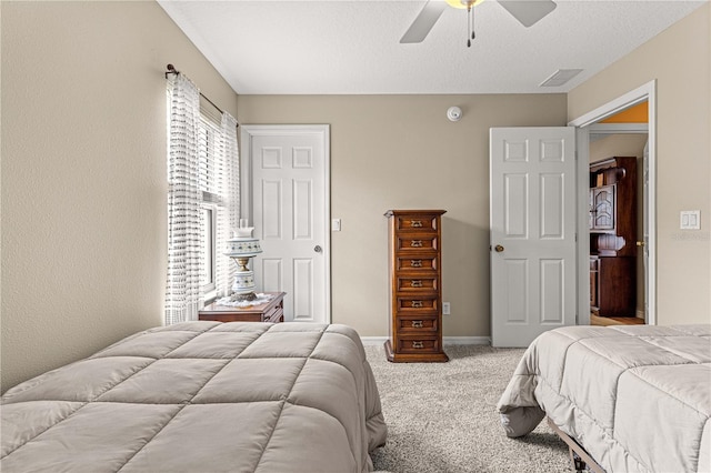 8732 SW 60th Cir, Ocala, FL 34476 - bedroom with carpet flooring, ceiling fan, baseboards, and a textured ceiling