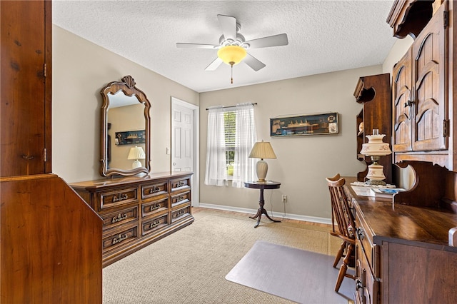 8732 SW 60th Cir, Ocala, FL 34476 - home office with ceiling fan, a textured ceiling, light colored carpet, and baseboards