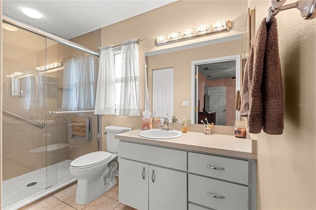 8732 SW 60th Cir, Ocala, FL 34476 - full bath featuring toilet, vanity, a shower stall, and tile patterned flooring