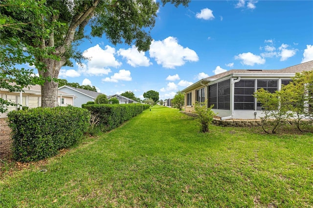 8732 SW 60th Cir, Ocala, FL 34476 - view of green lawn with a sunroom