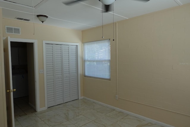 2810 SE Lake Weir Ave, Ocala, FL 34471 - unfurnished bedroom featuring attic access, light marble finish floors, a closet, baseboards, and a ceiling fan