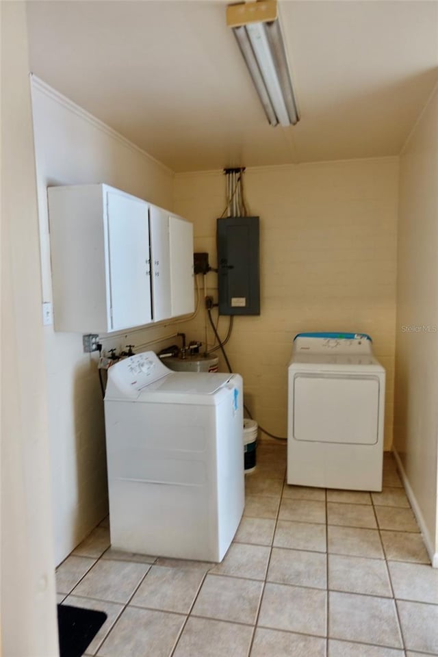 2810 SE Lake Weir Ave, Ocala, FL 34471 - washroom featuring electric panel, separate washer and dryer, light tile patterned floors, and crown molding