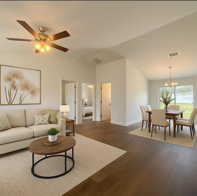 3527 SW 149th Ter, Ocala, FL 34481 - living area with vaulted ceiling, dark wood-type flooring, a chandelier, baseboards, and a ceiling fan