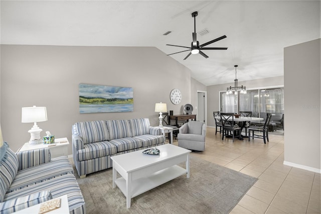 11326 SE 175th Pl, Summerfield, FL 34491 - living area featuring a ceiling fan, a chandelier, vaulted ceiling, baseboards, and light tile patterned floors