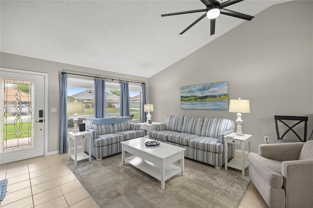 11326 SE 175th Pl, Summerfield, FL 34491 - living area featuring light tile patterned floors, lofted ceiling, a ceiling fan, plenty of natural light, and baseboards