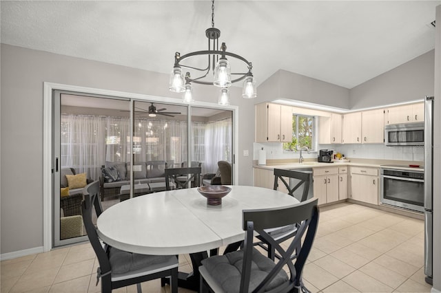 11326 SE 175th Pl, Summerfield, FL 34491 - dining area with light tile patterned floors, ceiling fan, lofted ceiling, and a chandelier