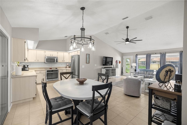 11326 SE 175th Pl, Summerfield, FL 34491 - dining area featuring light tile patterned floors, ceiling fan, and high vaulted ceiling
