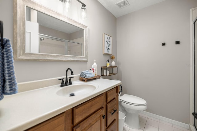 11326 SE 175th Pl, Summerfield, FL 34491 - full bathroom featuring toilet, vanity, a stall shower, tile patterned floors, and baseboards