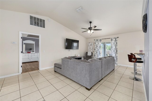 63 Walnut Crse, Ocala, FL 34480 - living area featuring vaulted ceiling, ceiling fan, light tile patterned floors, and baseboards